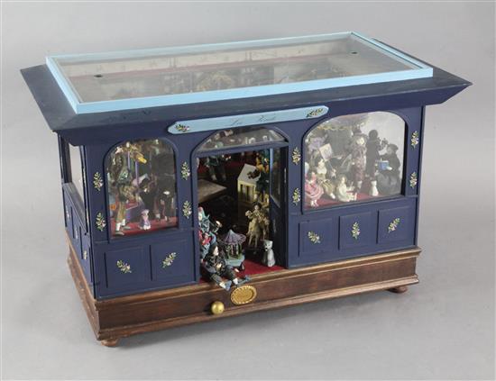 A Camus musical automaton modelled as a doll makers shop La Voule, width 37in. height 23in. depth 19in.